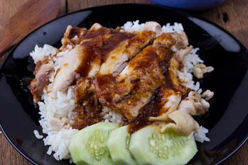 Thai food gourmet steamed chicken with rice , khao mun kai in wood background