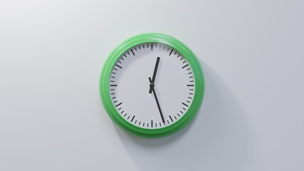 Glossy green clock on a white wall at twenty-seven past twelve. Time is 00:27 or 12:27