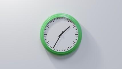 Glossy green clock on a white wall at thirty-five past one. Time is 01:35 or 13:35