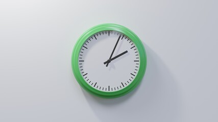 Glossy green clock on a white wall at four past two. Time is 02:04 or 14:04