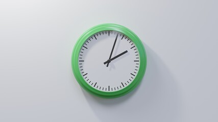 Glossy green clock on a white wall at three past two. Time is 02:03 or 14:03