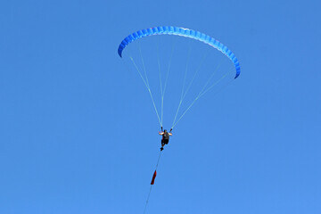 Paraglider being towed on a winch launch	