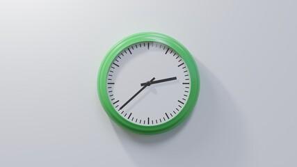 Glossy green clock on a white wall at thirty-eight past two. Time is 02:38 or 14:38