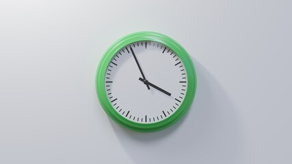 Glossy green clock on a white wall at fifty-six past three. Time is 03:56 or 15:56