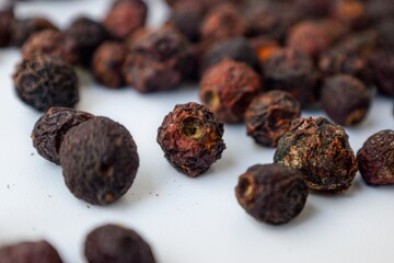 Dried cherries scattered on a white background. Vitamins for the winter.