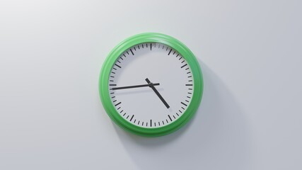 Glossy green clock on a white wall at forty-four past four. Time is 04:44 or 16:44