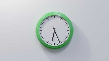 Glossy green clock on a white wall at twenty-six past six. Time is 06:26 or 18:26
