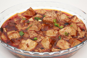 Close up of  popular Chinese dish from the Sichuan province Mapo tofu in glass dish