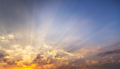 Beautiful colorful sunset sky with orange clouds. Nature sky background. Dramatic sunset.