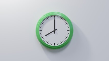 Glossy green clock on a white wall at eight o'clock. Time is 08:00 or 20:00