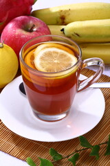 Close up of A glass of Lemon tea with fruits