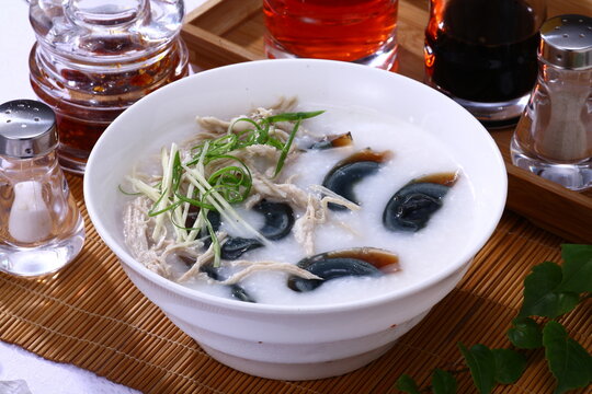 Close up of a typical Hong Kong and Cantonese style cuisine Preserved eggs and salty pork congee