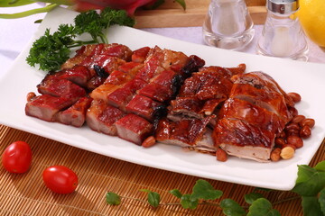 Close up of Hong Kong and Cantonese style Roast Duck and BBQ Pork with Honey Sauce together