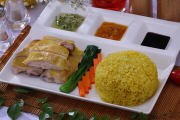 Close up view of Hainan Chicken Rice with three sauces and  Vegetable