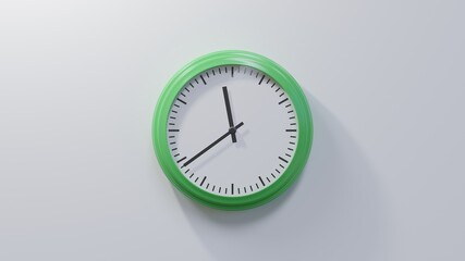 Glossy green clock on a white wall at thirty-nine past eleven. Time is 11:39 or 23:39
