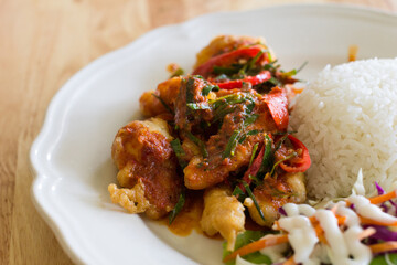 chicken fried in a spicy sauce and rice, Thai