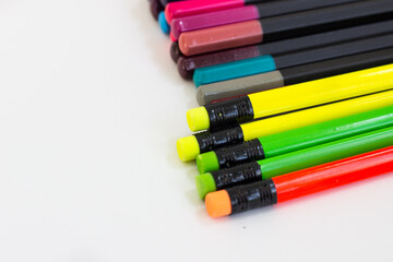 colored pencils on a white background