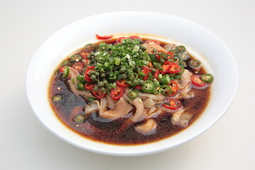 Close up of  a typical Chinese Sichuan province cuisine Duck intestines with hot chili sauce
