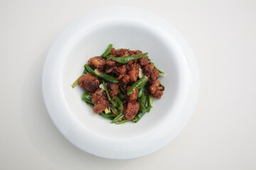 Close up of  a typical Chinese Sichuan province cuisine Fried chicken with green pepper