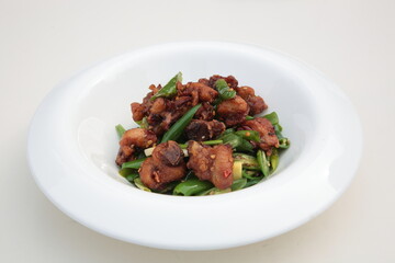 Close up of  a typical Chinese Sichuan province cuisine Fried chicken with green pepper