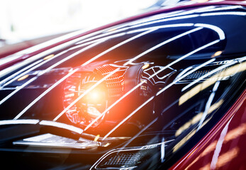 Headlights and details of red sport car