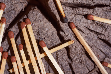 wooden matches lie on the wooden frame. Close-up.