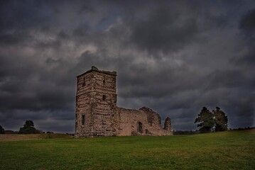 Storm clouds over Knowlton Church in Dorset, UK