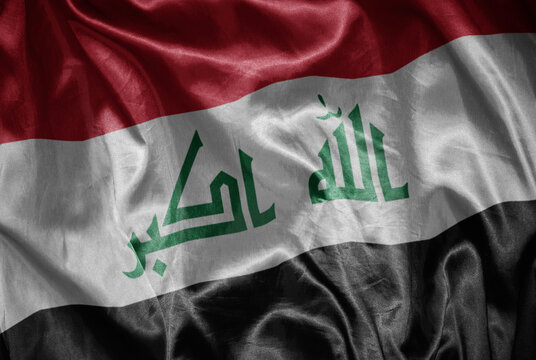 colorful shining big national flag of iraq on a silky texture