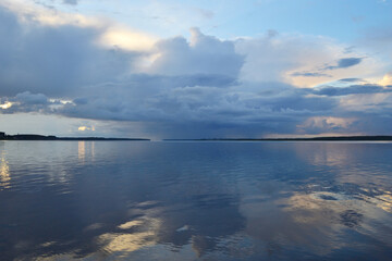 Dramatic background of the sunset with purple sky and sea.