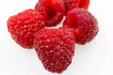 raspberries on white background