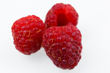 raspberries on white background
