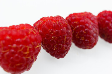 raspberries on white background