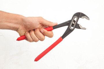 Pliers in hand and icholized on a white background. Home renovation tools.