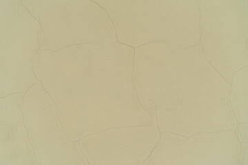 texture of beige wall with cracks, cracked surface
