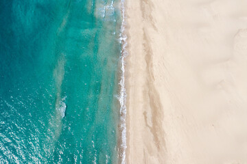 Fototapeta na wymiar Aerial view of turquoise sea waves and sandy beach in Kas Patara, Antalya, Turkey,