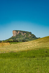 The Pietra di Bismantova (Stone of Bismantova) viewed from the ground.  Castelnovo ne' Monti, Reggio Emilia province, Emilia Romagna, Italy.