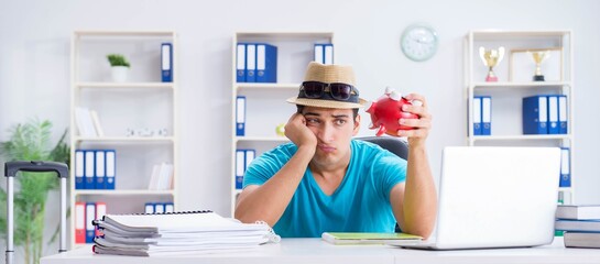 Businessman preparing for vacation in the office