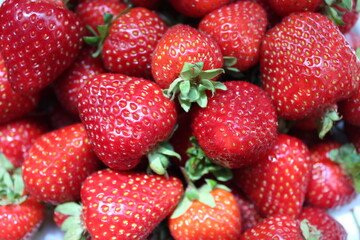 Summer, fresh strawberries on a berries background