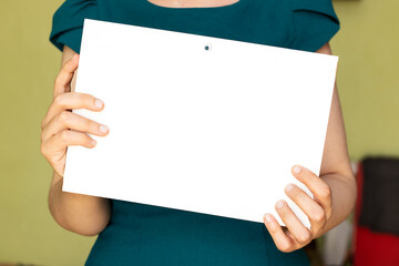 closeup woman holding a blank cardboard 
