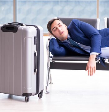 Businessman waiting at the airport for his plane in business cla