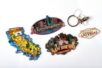 Tourist souvenirs of the USA cities. Trinket magnets of California, San Diego, Los Angeles and Las Vegas. Isolated on white background.