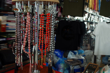 isolated colorful crystal beads hanging out with soft focus blurred background ,selective focus on main subject beads