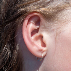 Ear side of the girl, close-up