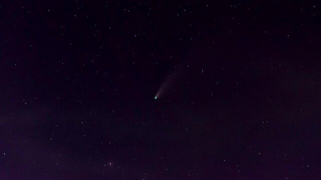 Time lapse video 4K, Comet C/2020 F3 (NEOWISE) at night among the stars.