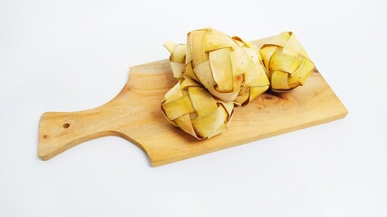Kupat or ketupat Indonesian traditional food with rice ingredients wrapped with palm leaves isolated on white background