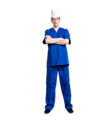 A man in a blue doctor suit and cap on a white background, isolated