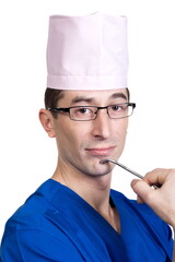 A man in a blue doctor suit and cap on a white background, isolated