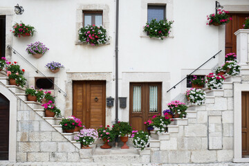 Fototapeta na wymiar Pescocostanzo - Abruzzo - the village of flowers with the characteristic architecture of the houses.