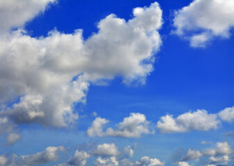 Naklejka na ściany i meble Beautiful blue sky in a sunny day with clouds. 