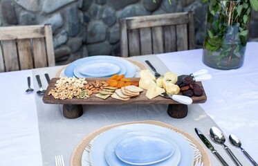 High angle shot of dining set and snacks on the table in a cafe